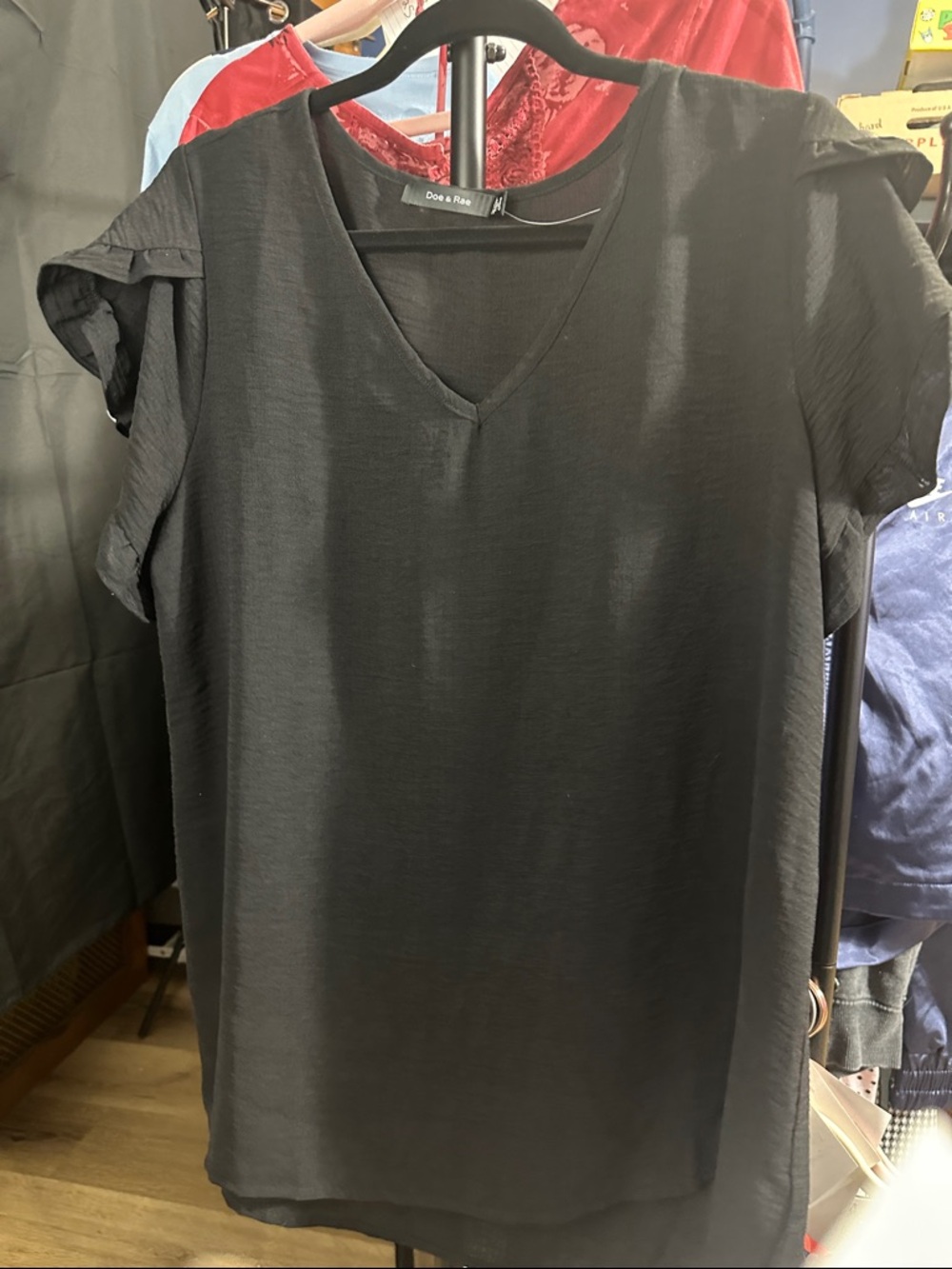 60. Black Shirt